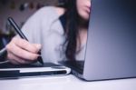 Girl Writing On A Tablet Stock Photo