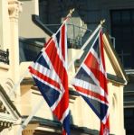 British Union Jacks Outside A Building In England Stock Photo