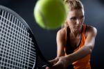 Beautiful Woman Playing Tennis Indoor. Isolated On Black Stock Photo