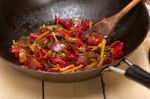 Fried Chili Pepper And Vegetable On A Wok Pan Stock Photo