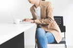 Attractive Women In Casual Business Sitting At A Table Working O Stock Photo