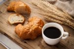 Tasty Croissant And Coffee Still Life Rustic Stock Photo