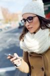 Young Beautiful Woman Using Her Mobile Phone On A  Bus Stock Photo