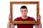 Man Holding Wooden Picture Frame Stock Photo