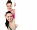 Two Attractive Girls Holding Blank Whiteboard Stock Photo