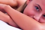 Young Woman Laying On Massage Bed Stock Photo