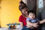 Mother And Son Standing At The House Stock Photo