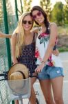 Young Beautiful Girls Having Fun In The Park Stock Photo