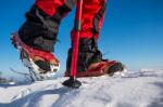 View Of Walking On Snow With Snow Shoes And Shoe Spikes In Winte Stock Photo