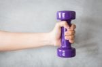 Woman Hand Holding Violet Dumbbell Stock Photo