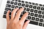 Close Up Hand Type On Laptop Keyboard Stock Photo