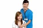 Young Patient Being Examined By A Cheerful Doctor Stock Photo