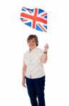 Senior Lady Holding UK Flag Stock Photo