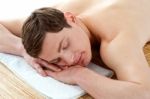 Man Relaxing In A Spa Resort On Mat Stock Photo