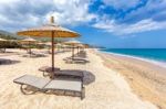 Beach Umbrellas In Rows On Sandy Beach With Sea Stock Photo