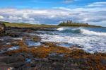 View Of Dunstanburgh Castle At Craster Northumberland Stock Photo