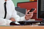 Businessman Using Smart Phone During Working Stock Photo