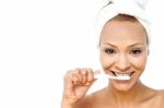 Young Woman Brushing Her Teeth Stock Photo