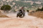 Man Riding Quad Bike Stock Photo