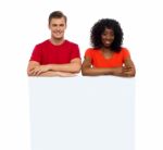 Smiling Friends With Blank Board Stock Photo