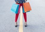 High Heels Girls With Shopping Bags Walking On Street Stock Photo