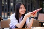 Asia Thai High School Student Uniform Beautiful Girl Read A Book Stock Photo