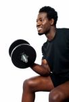 Muscular Man Lifting Dumbbell Stock Photo