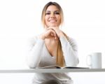 Young Beautiful Girl Reading News And Drinking Coffee. Isolated Stock Photo