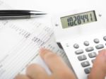 Bookkeeping With Calculator Stock Photo