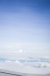 Cloudy Sky View From Airplane Cabin Window Stock Photo