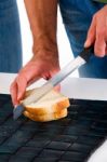 Man Cutting Sandwich  Stock Photo