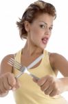 Young Lady Holding Fork And Knife Stock Photo