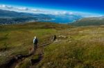 Couple Descending From Norway Mountain Background Stock Photo