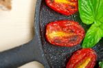 Baked Cherry Tomatoes With Basil And Thyme Stock Photo