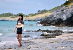 Young Woman On Beach Summer Holiday Stock Photo