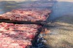 Traditional Meat Grilled On The Grill In The Argentine Countryside Stock Photo