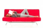 Woman Lying On Sofa Stock Photo