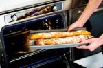 Woman Holding Baguette Stock Photo