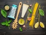 The Thin Spaghetti On Black Wooden Background. Yellow Italian Pa Stock Photo