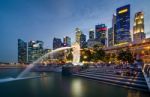 Merlion Statue Fountain In Merlion Park And Singapore City Stock Photo