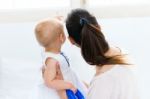 Baby Girl And Her Mother Playing At Home Stock Photo