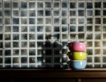 Colorful Tiffin Carrier On Wooden Cupboard Stock Photo