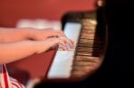 Girl Plays Piano Stock Photo