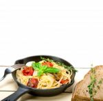 Spaghetti Pasta With Baked Cherry Tomatoes And Basil Stock Photo