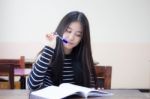 Portrait Of Thai Teen Beautiful Girl Writing Book Stock Photo