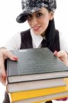 Student In Cap Holding Stack Of Books Stock Photo