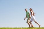 Young Couple Running Stock Photo