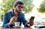 Modern Young Man With Mobile Phone In The Street Stock Photo