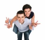 Brother And Sister Showing Victory Sign Stock Photo