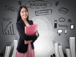 Asian Woman Smiling On Business Background Stock Photo